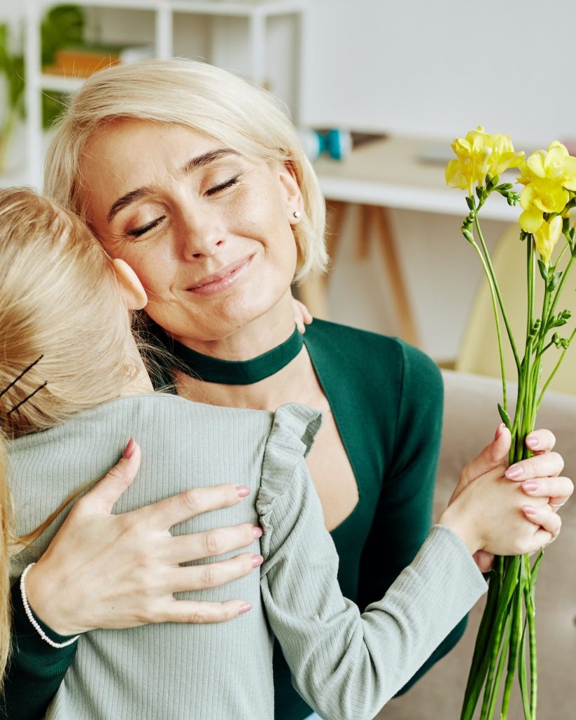 Girl Embracing Mom on Mothers Day